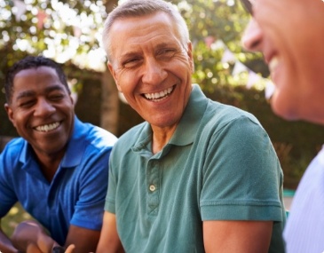 Group of men laughing together outdoors