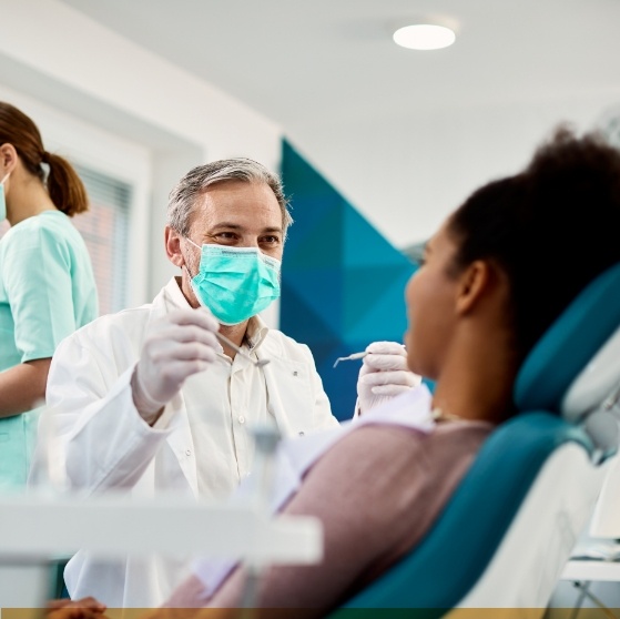 Dentist about to treat a female patient