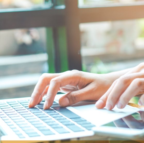 Person typing on a laptop