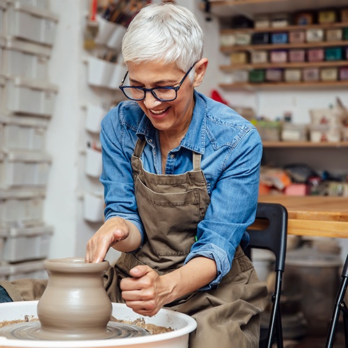 Woman smiling during ceramics class