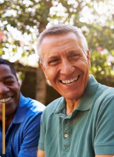 Small group of men laughing together outdoors