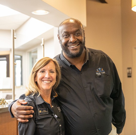 Man and woman smiling together in Stone Mountain dental office